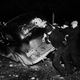 A group of strike sympathizers is shown tipping over an automobile loaded with sheriff’s deputies during the riot at the strike-closed Fisher Body#2